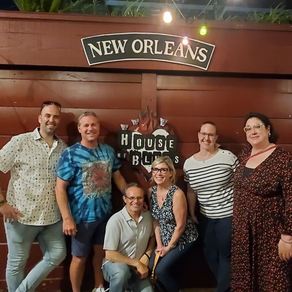 Employees of Altasciences posing in front of the House of Blues sign in New Orleans, LA. 