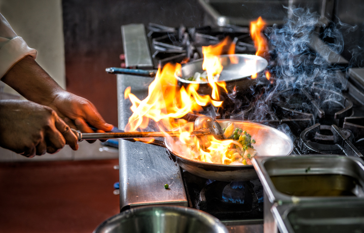 fire in pan on stovetop