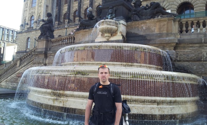 Martin Poirier standing in front of decorative fountain in Prague